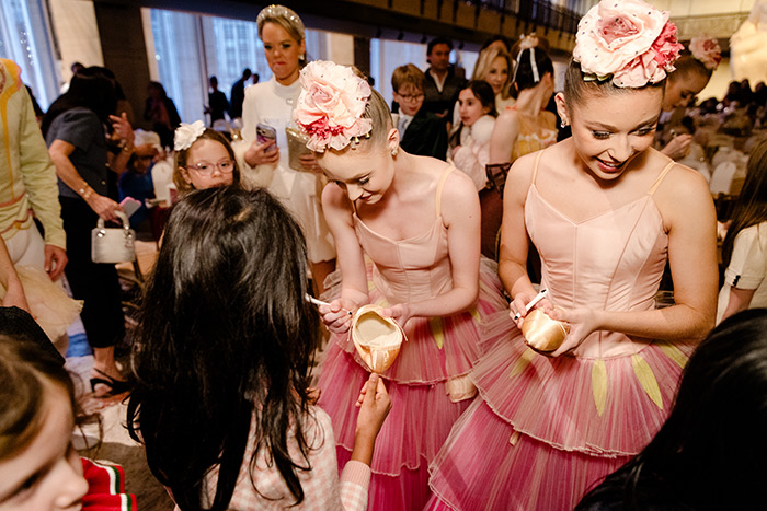 NYCB Corps de Ballet members Allegra Inch and Grace Scheffel signing autographs with young guests