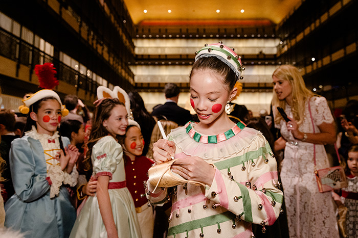 School of American Ballet student signing autographs