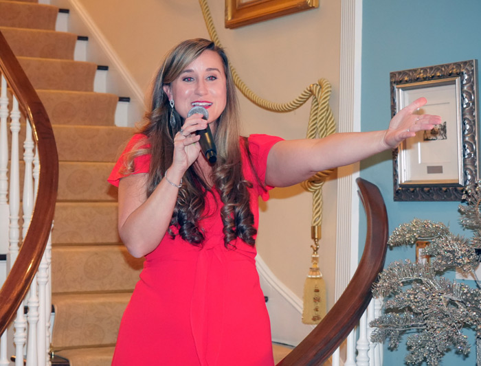 Opera singer Lauren Jelencovich, who segued from arias to carols and got the room singing along on their feet.