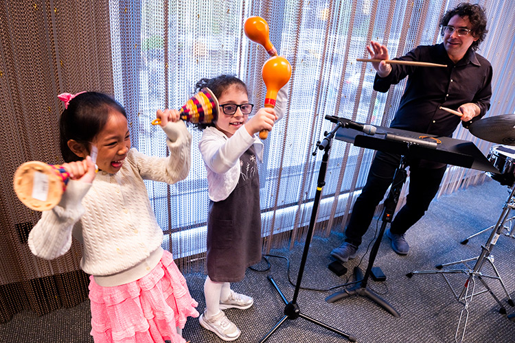Children enjoyed pre-concert activities, including instrument tryouts, at the Young People’s Concert in David Geffen Hall
